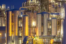 Chemical industry detail installation background at night. Petrochemical close up of factory.