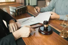 Client is bringing the documents to clarify the law to the lawyer at the prosecutor office.