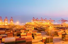 container wharf in nightfall, international import and export trade background