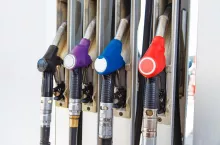 Fuel nozzle dispensing pump at gas station. The power concept.