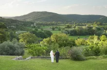 Rear of wedding couple in garden