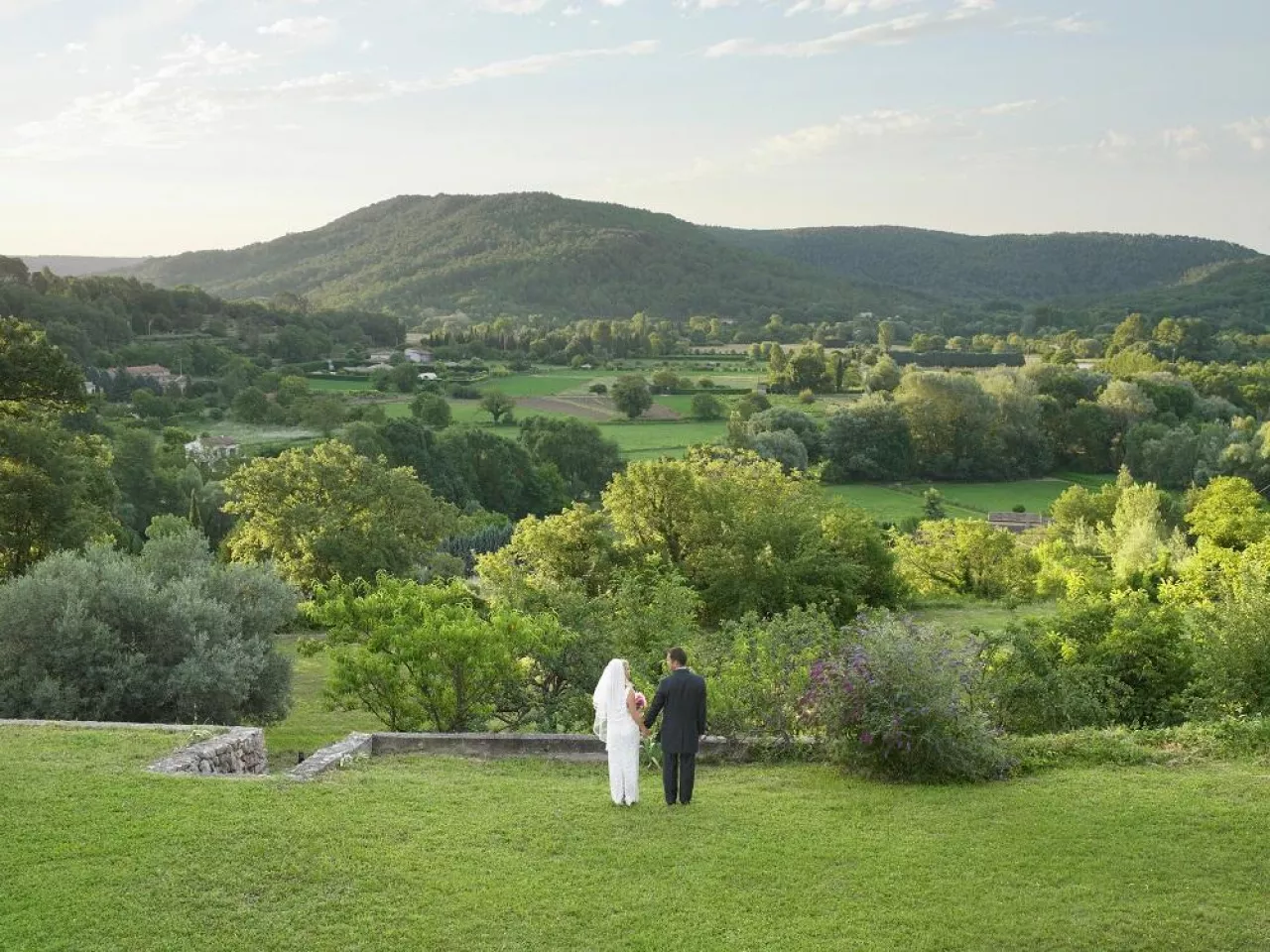 Rear of wedding couple in garden