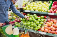 Hand picking apples at a fruit counter