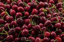 Dark Red Sweet Cherries at Fruit Stall Closeup